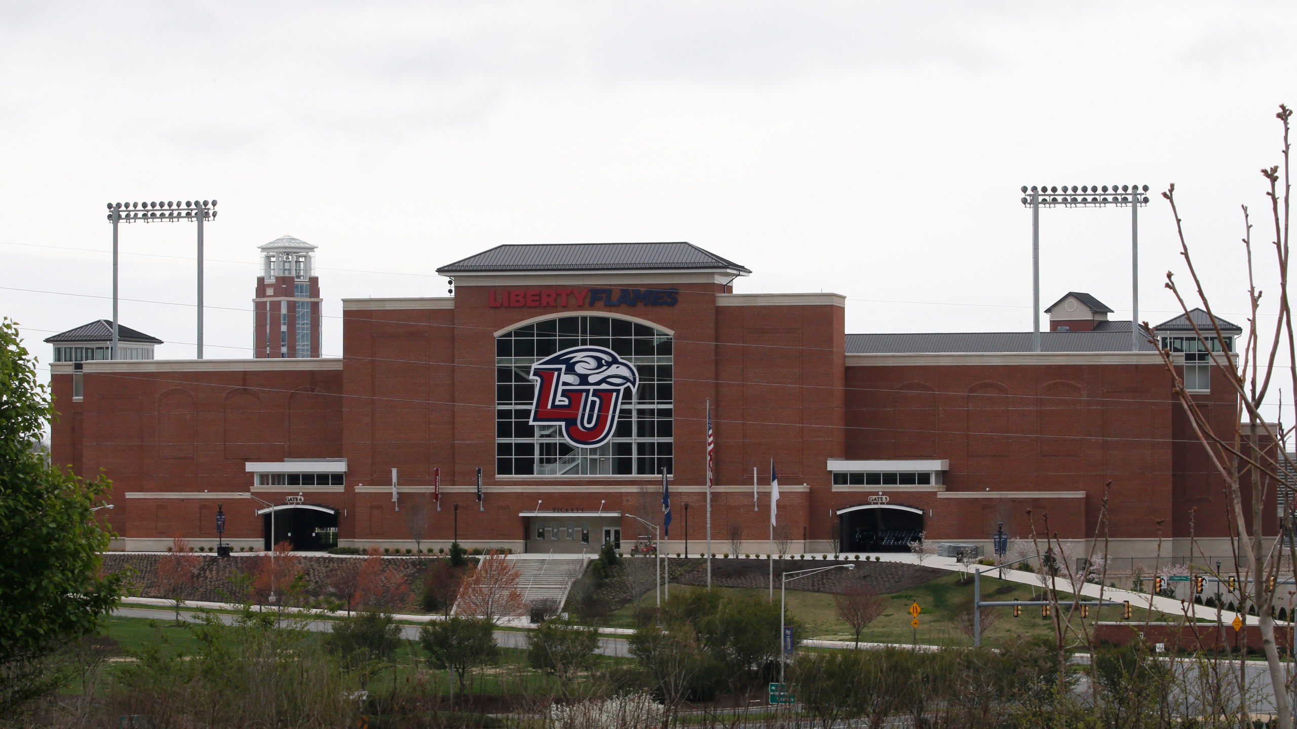 Liberty University's football stadium was empty as students were welcomed back to the university's campus, Tuesday March 24 , 2020, in Lynchburg, Va. Officials in Lynchburg, said Tuesday they were fielding complaints and concerns about the hundreds of students that have returned from their spring break to Liberty University, where President Jerry Falwell Jr. has welcomed them back amid the coronavirus pandemic. (AP Photo/Steve Helber)