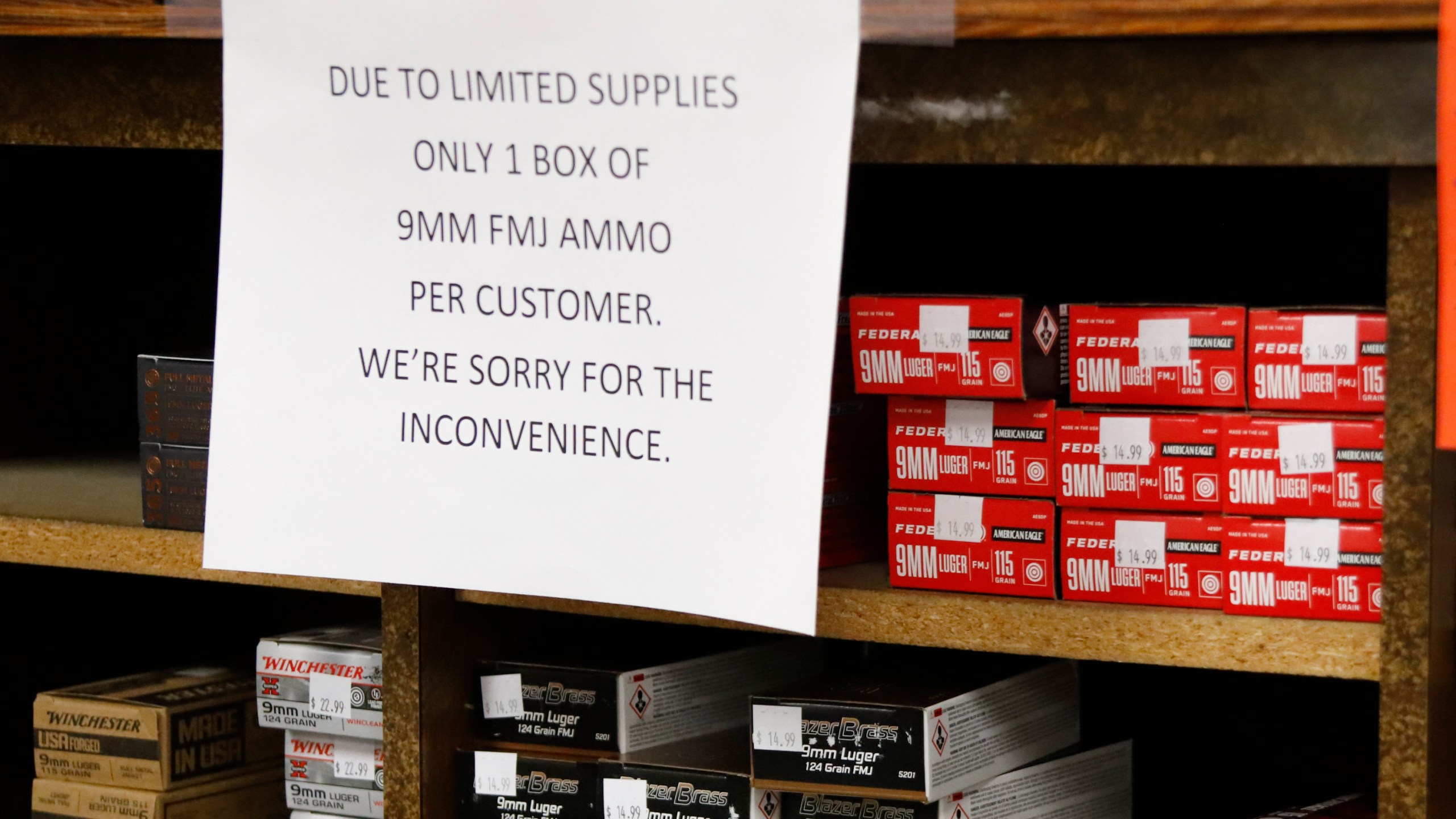 Signs point out quantity limits on certain types of ammunition after Dukes Sport Shop reopened, Wednesday, March 25, 2020, in New Castle, Pa. under the new conditions specified for gun stores. The store had closed last week when Pennsylvania Gov. Tom Wolf ordered a shut down of non-essential businesses to slow the spread of the coronavirus. (AP Photo/Keith Srakocic)