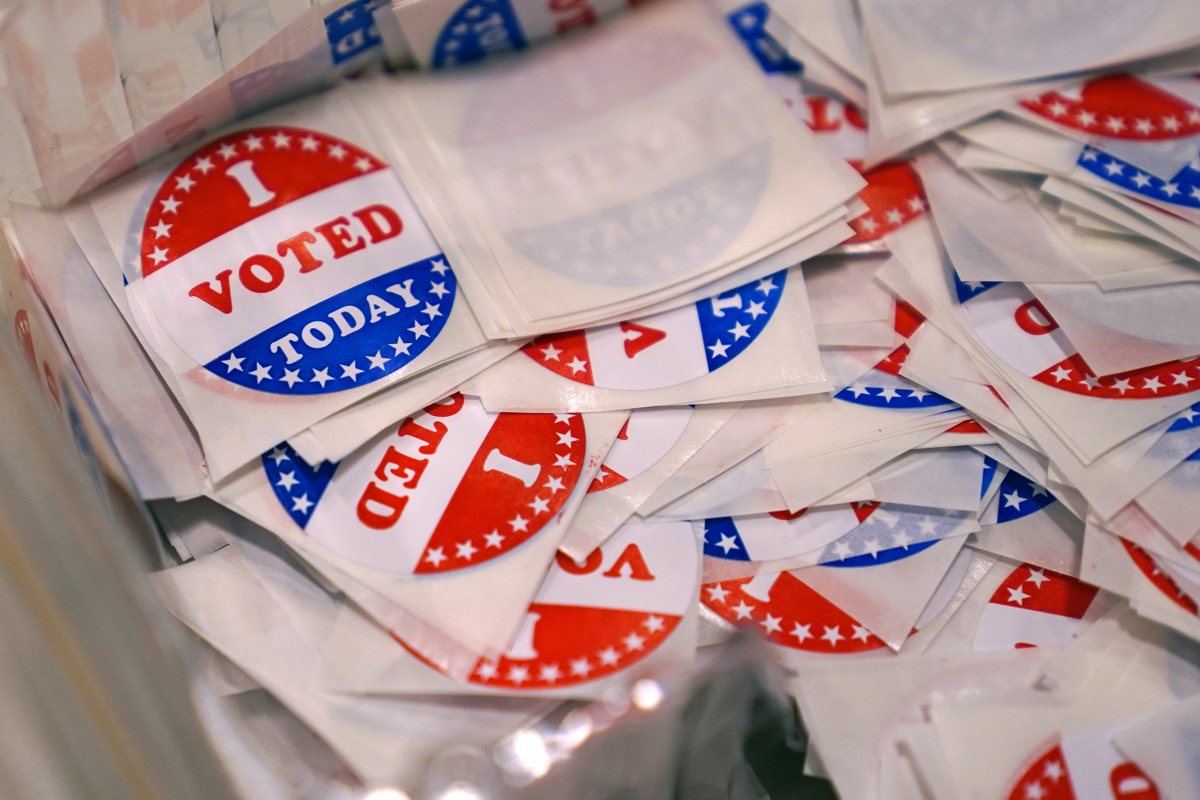 FILE - A bin of "I Voted Today" stickers rests on a table at a polling place, Sept. 13, 2022, in Stratham, N.H. A New Hampshire man who posted a fake Craigslist ad for a free trailer with a legislative candidate’s number on the day of the election has lost his right to vote in the state. Michael Drouin, 30, pleaded guilty Monday, April 24, 2023, to creating a false document after a flood of unwanted calls and texts jammed up the candidate's cell phone. (AP Photo/Charles Krupa, File)