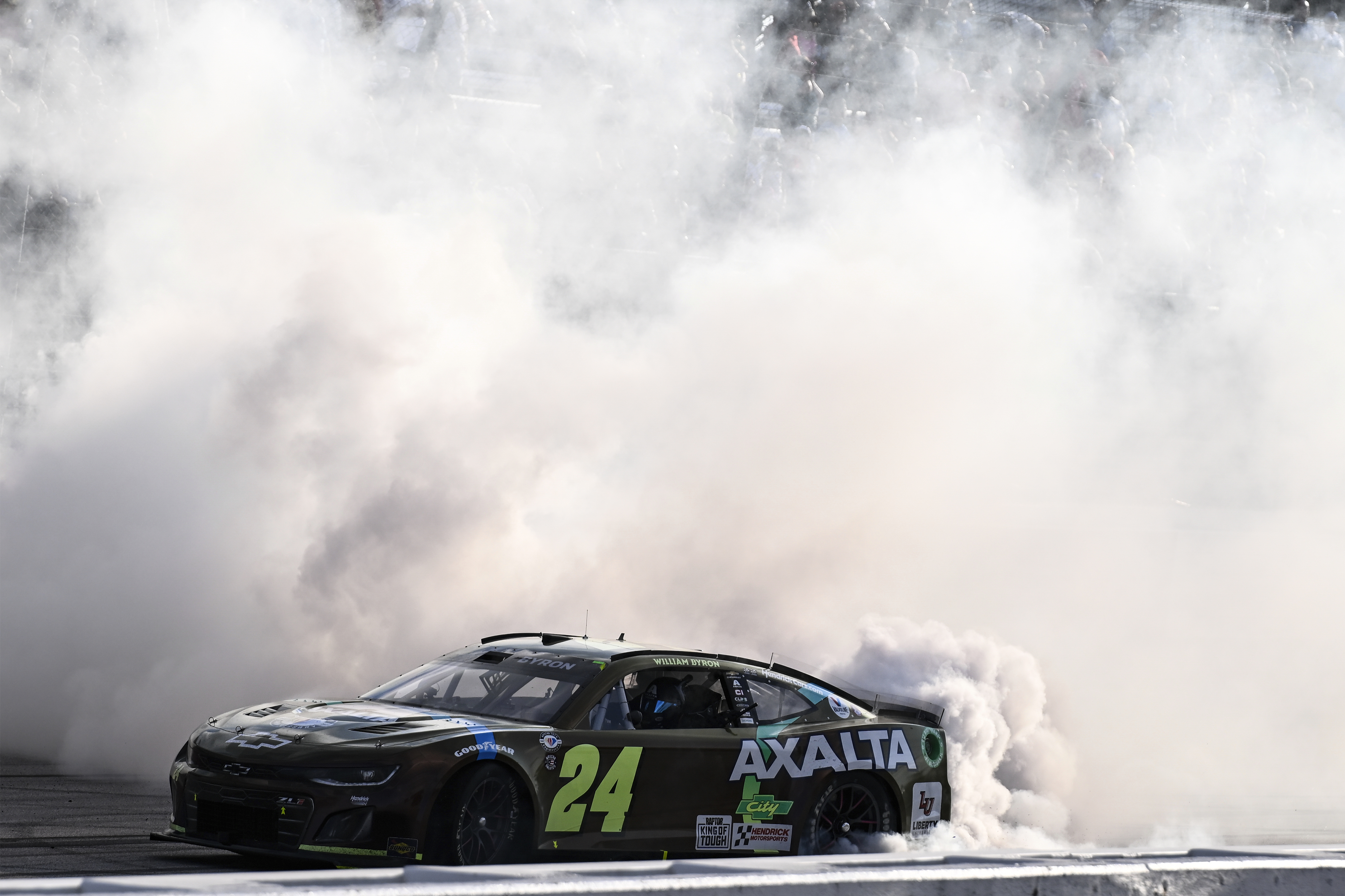 William Byron (24) does a burnout after winning a NASCAR Cup Series auto race at Darlington Raceway, Sunday, May 14, 2023, in Darlington, S.C. (AP Photo/Matt Kelley)